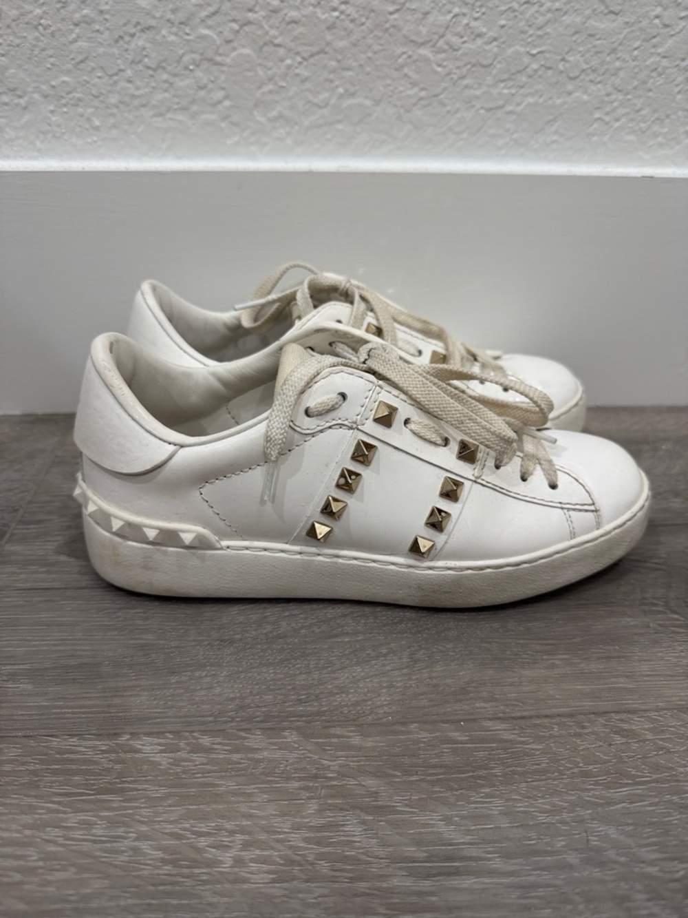 Valentino Garavani White Leather Sneakers with Gold Pyramid Studs